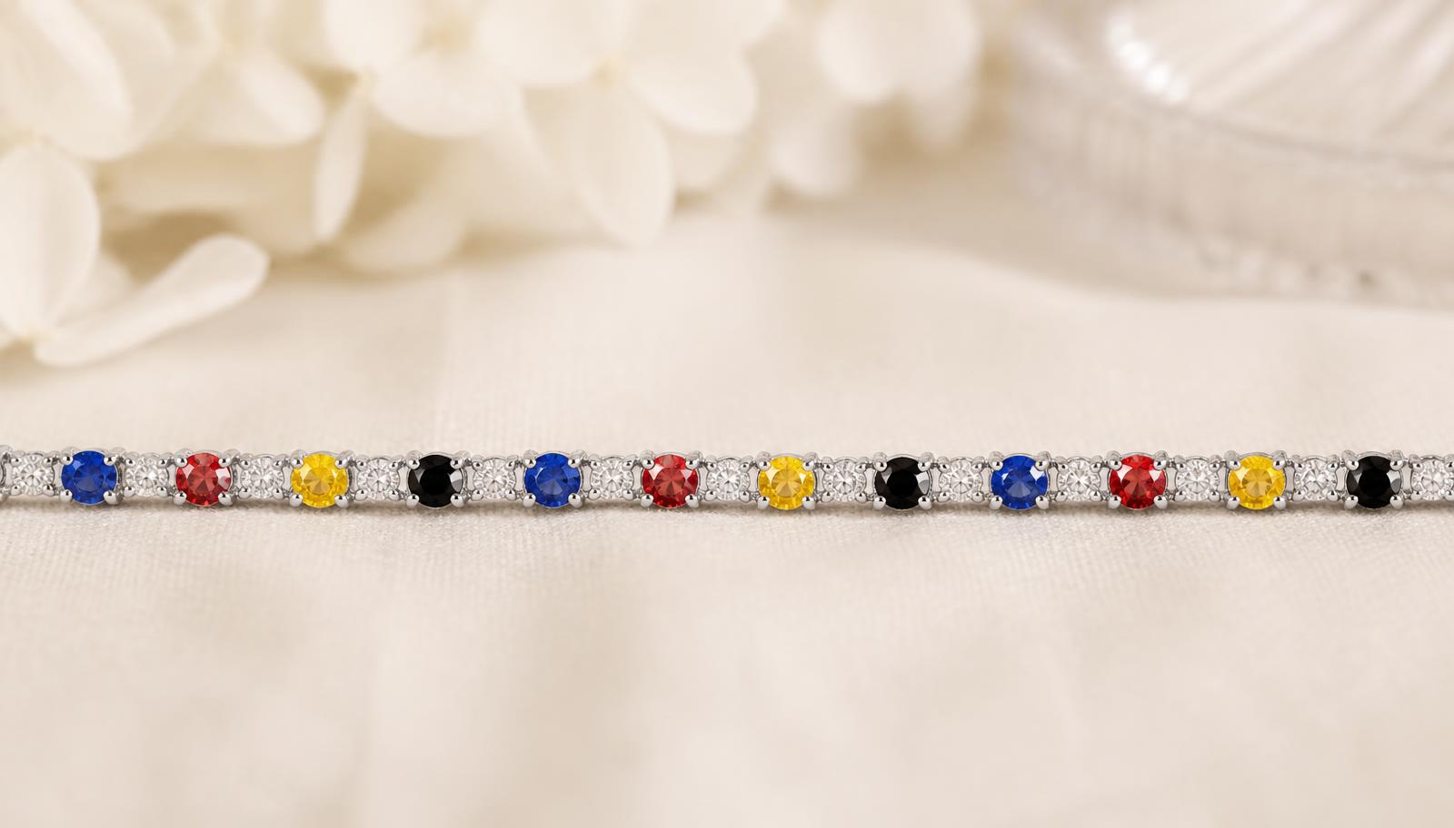Fine tennis bracelet set with blue, red, yellow and black stones