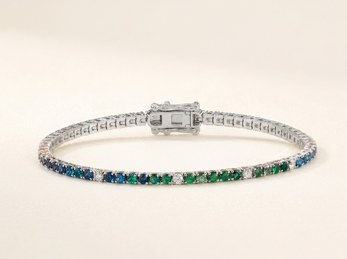 Persephone study tennis bracelet in peacock blue, teal and emerald gemstones